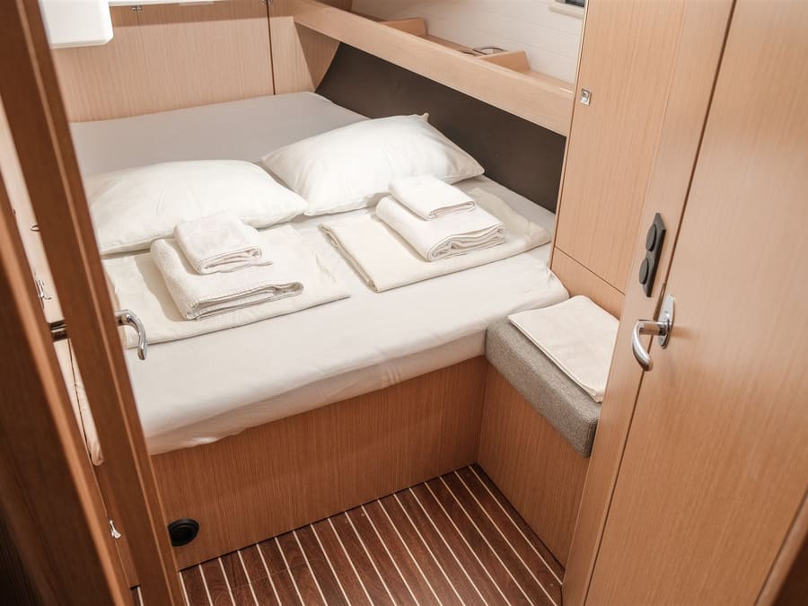 A cabin on Freya with a made-up double bed